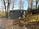 Exterior view of a backyard with wood stairs and deck at 4366 Glenwood Pkwy, Decatur, GA 30032