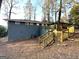View of backyard with wooden stairs to a wood deck at 4366 Glenwood Pkwy, Decatur, GA 30032