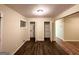 Bedroom featuring wood-look floors, neutral paint and trim, and standard window at 4366 Glenwood Pkwy, Decatur, GA 30032