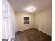 Bedroom featuring tan walls, carpet, and a standard window at 4366 Glenwood Pkwy, Decatur, GA 30032