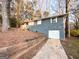Brick home with a garage and retaining wall at 4366 Glenwood Pkwy, Decatur, GA 30032