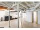 Unfinished basement with exposed ductwork, support beams, and some storage space with washer and dryer at 3571 Lake Se Dr, Smyrna, GA 30082