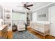 Bright Bedroom with hardwood floors, ceiling fan, neutral walls, and a blue rug to complement the décor at 3571 Lake Se Dr, Smyrna, GA 30082