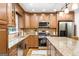 Updated kitchen featuring granite countertops, stainless steel appliances, and custom cabinetry at 3571 Lake Se Dr, Smyrna, GA 30082