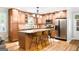 Well-equipped kitchen with granite countertops, stainless steel appliances, a breakfast bar, and ample cabinet space at 3571 Lake Se Dr, Smyrna, GA 30082