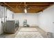 Basement laundry room area with washer and dryer hookups, plus storage space at 3571 Lake Se Dr, Smyrna, GA 30082