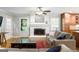 Comfortable living room featuring a fireplace and an open doorway to the backyard at 3571 Lake Se Dr, Smyrna, GA 30082
