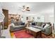 Spacious living room with hardwood floors, an area rug, comfortable couches, and seamless flow into the kitchen at 3571 Lake Se Dr, Smyrna, GA 30082