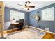 Home office space featuring natural light from a window, a ceiling fan, and a rug to enhance the space at 3571 Lake Se Dr, Smyrna, GA 30082