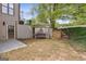 Landscaped backyard with a cozy swing and a stairway that goes up a terrace at 3823 Heritage Pl, Buford, GA 30519