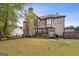 Expansive backyard featuring a spacious deck perfect for outdoor entertaining and leisure at 3823 Heritage Pl, Buford, GA 30519