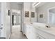 This is a bright bathroom with double sinks, a large mirror, and entry to another room at 3823 Heritage Pl, Buford, GA 30519