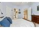 Cozy bedroom with ensuite bathroom and view of the upper landing at 3823 Heritage Pl, Buford, GA 30519
