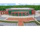 Modern brick building with large glass windows and ample parking, suitable for various purposes at 3823 Heritage Pl, Buford, GA 30519