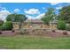 Stone entrance to Heritage Crest with manicured landscaping and lush green lawn at 3823 Heritage Pl, Buford, GA 30519