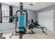 This home gym includes a multi-station weight machine with bench and free weights at 3823 Heritage Pl, Buford, GA 30519