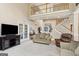 Open concept living room with a staircase, tall ceilings, and fireplace at 3823 Heritage Pl, Buford, GA 30519