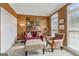 Cozy living room with a red couch, colorful armchair, and bright paint at 3823 Heritage Pl, Buford, GA 30519
