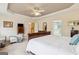 Comfortable main bedroom showcasing a trey ceiling, soft colors, and a calm ambiance at 3823 Heritage Pl, Buford, GA 30519