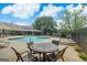 Community pool with lounge chairs and seating areas, ideal for relaxing and socializing at 3823 Heritage Pl, Buford, GA 30519