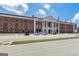 Traditional school building with prominent columns and a stately facade, reflecting academic excellence at 3823 Heritage Pl, Buford, GA 30519