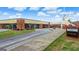 Well-maintained school exterior with brick facade and manicured landscaping, enhancing curb appeal at 3823 Heritage Pl, Buford, GA 30519