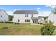 Backyard of a two-story house with a well-maintained lawn at 1940 Van Allen Ct # 12, Dacula, GA 30019