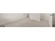 Unfurnished basement area with neutral carpeting and white walls at 1940 Van Allen Ct # 12, Dacula, GA 30019
