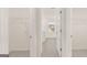 Dual walk-in closets, leading to a bathroom featuring dual sinks and vanity at 1940 Van Allen Ct # 12, Dacula, GA 30019
