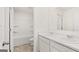 Bathroom with double vanity, white cabinets, and a shower-tub combination at 1940 Van Allen Ct # 12, Dacula, GA 30019