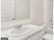 Bathroom with an oval sink, granite countertops, a mirror, and a toilet at 1940 Van Allen Ct # 12, Dacula, GA 30019