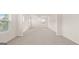 Spacious bedroom with neutral carpet, bright light, and views through the large window at 1940 Van Allen Ct # 12, Dacula, GA 30019