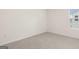 Unfurnished bedroom with gray carpet, white trim, and a window at 1940 Van Allen Ct # 12, Dacula, GA 30019