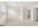 Bright bedroom featuring closet, neutral walls, and plush carpeting at 1940 Van Allen Ct # 12, Dacula, GA 30019