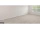 Empty bedroom with carpet flooring, white walls, and natural light at 1940 Van Allen Ct # 12, Dacula, GA 30019
