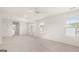 Large bedroom with neutral carpet, ceiling fan, bright light and windows with blinds at 1940 Van Allen Ct # 12, Dacula, GA 30019