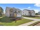 Beautiful two-story home boasts a brick and siding facade, manicured lawn, and attached two-car garage at 1940 Van Allen Ct # 12, Dacula, GA 30019