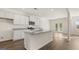 Bright, spacious kitchen featuring granite countertops, stainless steel appliances, and an open layout leading to the backyard at 1940 Van Allen Ct # 12, Dacula, GA 30019