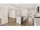 Bright open kitchen featuring stainless appliances, granite countertops and a kitchen island with a sink at 1940 Van Allen Ct # 12, Dacula, GA 30019