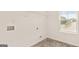 Spacious laundry room with tile flooring, bright window, and open shelf at 1940 Van Allen Ct # 12, Dacula, GA 30019