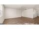 Open living room featuring wood-look floors and abundant natural light from a large window at 1940 Van Allen Ct # 12, Dacula, GA 30019