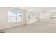 Open living room with abundant natural light and a ceiling fan at 1940 Van Allen Ct # 12, Dacula, GA 30019