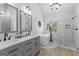 Luxurious bathroom featuring a double sink vanity, soaking tub, and separate shower with elegant marble tile surround at 226 Le Paradis Blvd, Sharpsburg, GA 30277