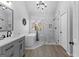 Bright bathroom with modern fixtures, a freestanding tub, and a glass-enclosed shower at 226 Le Paradis Blvd, Sharpsburg, GA 30277