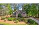 Traditional home with a landscaped yard, a cozy design, and mature trees at 226 Le Paradis Blvd, Sharpsburg, GA 30277
