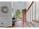 Inviting foyer with hardwood floors, high ceilings, and a view to the landscaped front yard at 226 Le Paradis Blvd, Sharpsburg, GA 30277