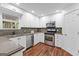 Charming kitchen with stainless steel appliances, sleek countertops, and ample cabinet space at 226 Le Paradis Blvd, Sharpsburg, GA 30277