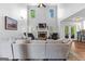 Open living room with soaring ceilings, fireplace, and comfortable seating at 226 Le Paradis Blvd, Sharpsburg, GA 30277