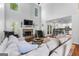 Spacious living room with fireplace, hardwood floors, and an open layout at 226 Le Paradis Blvd, Sharpsburg, GA 30277