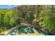 A wooded pond featuring a walking path and lush vegetation at 226 Le Paradis Blvd, Sharpsburg, GA 30277